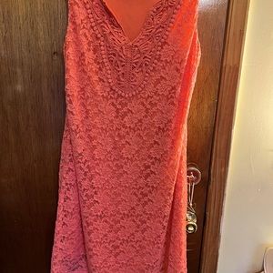 It’s a orange fully lace sleeveless dress by HANNI. It’s in good condition.